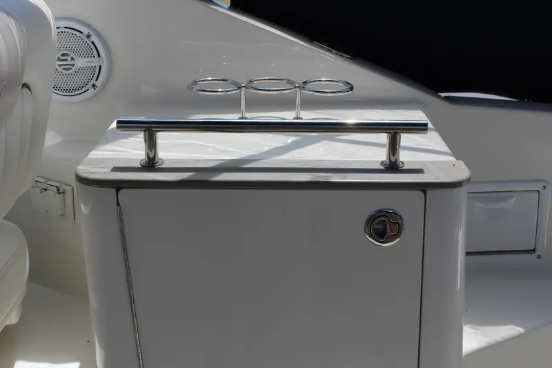 Slide: The Image of Interior detail of a 2011 Sea Ray Sundancer 260 boat, featuring a sleek cabinet and speaker. - 13