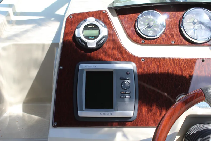 Slide: The Image of Dashboard of 2011 Sea Ray Sundancer 260 with Garmin GPS and Sony audio controls. - 22