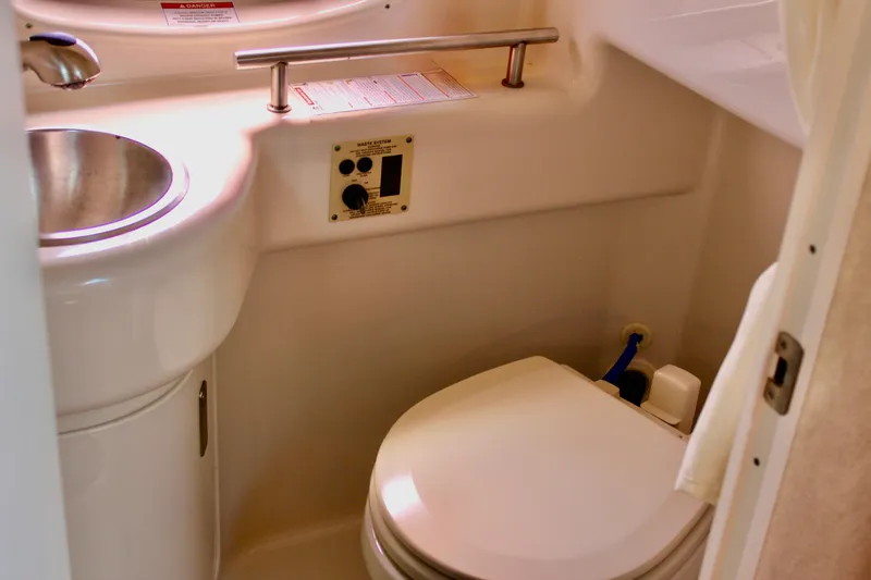 Slide: The Image of 2011 Sea Ray Sundancer 260 boat bathroom with sink and toilet. - 28