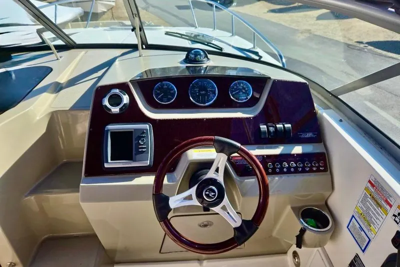 Slide: The Image of 2011 Sea Ray Sundancer 260 boat with blue canopy, docked at Magothy River. - 3