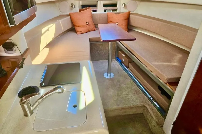 Slide: The Image of 2011 Sea Ray Sundancer 260 boat with blue canopy, docked at Magothy River. - 5