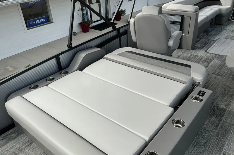 Slide: The Image of Luxurious seating on 2026 Qwest L-Class Splash Pad 24 pontoon boat interior. - 10