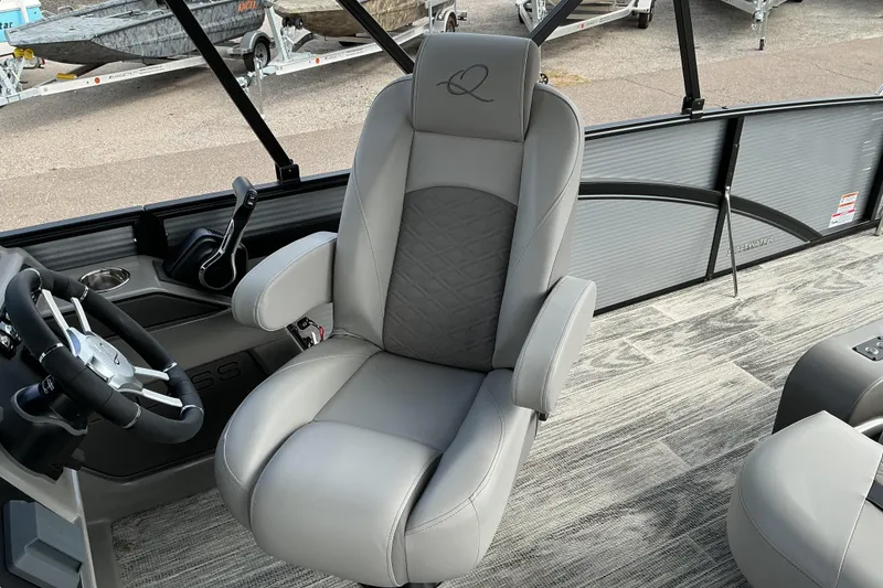 Slide: The Image of Captain's chair in 2026 Qwest L-Class Splash Pad 24 boat interior. - 14