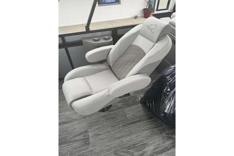 Slide: The Image of Luxurious seating on 2026 Qwest L-Class Splash Pad 24 boat, featuring elegant design and comfort. - 15