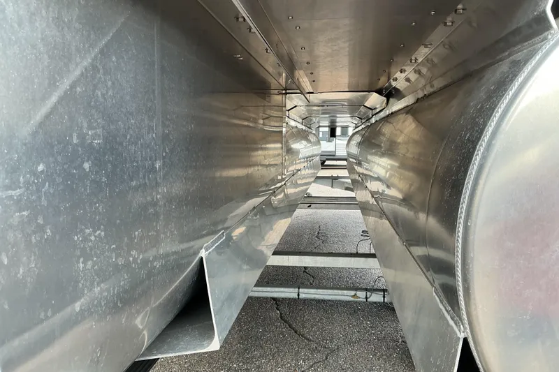 Slide: The Image of Underneath view of a 2026 Qwest L-Class Splash Pad 24 pontoon boat, showcasing aluminum structure. - 19
