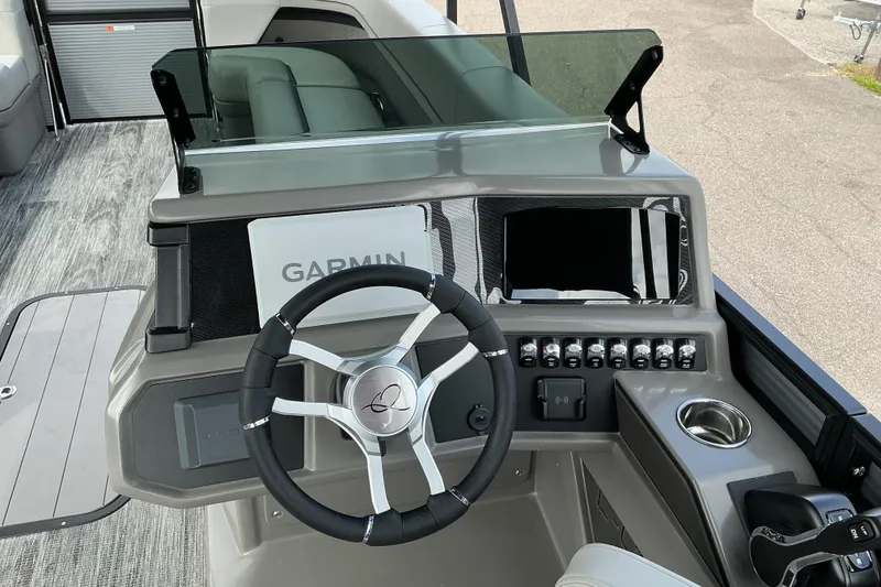 Slide: The Image of Steering console of 2026 Qwest L-Class Splash Pad 24 with Garmin navigation system. - 9