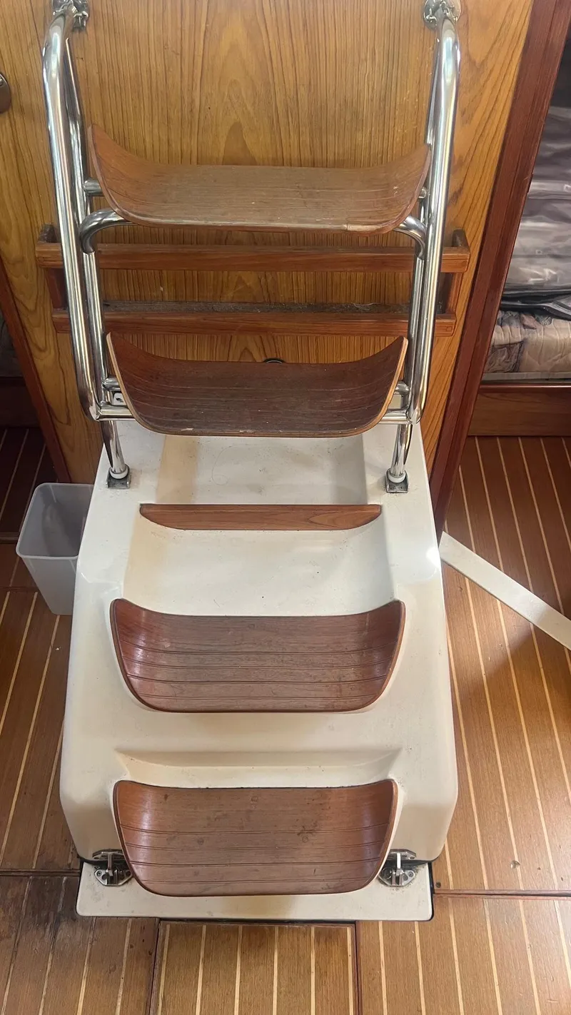 Slide: The Image of Wooden steps on a Hunter 410 sailboat, model year 2000, with metal railings. - 17