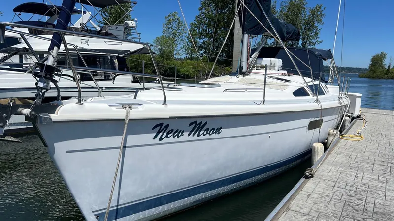 Slide: The Image of Sailboat "New Moon" docked, Hunter 410 model, year 2000, under clear blue sky. - 2