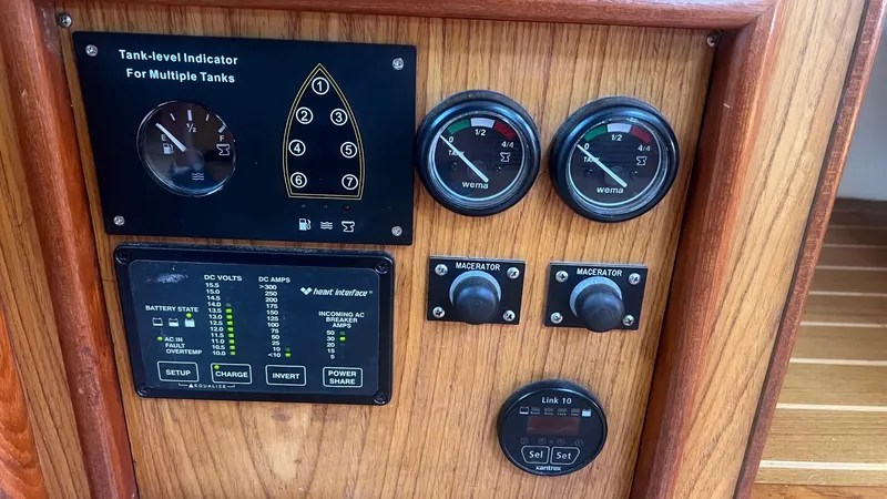 Slide: The Image of Control panel of a 2000 Hunter 410 boat with gauges and indicators. - 30
