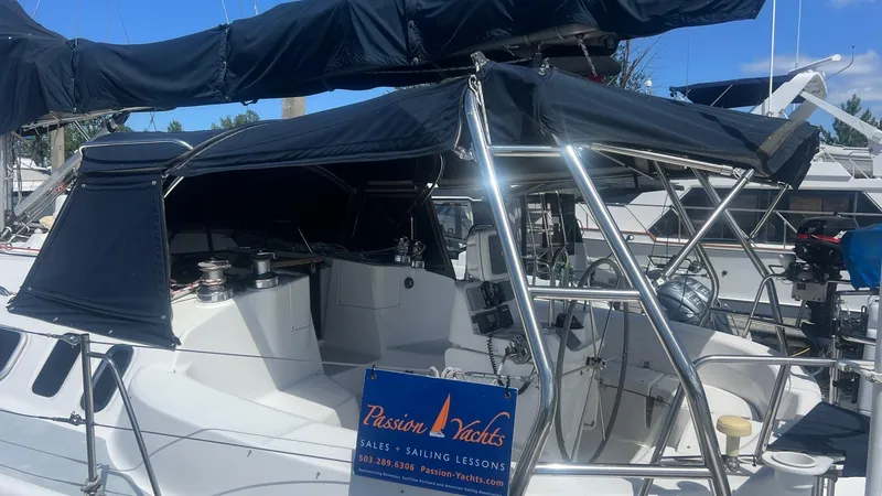 Slide: The Image of Sailboat Hunter 410, year 2000, with navy canopy and Passion Yachts sign. - 36
