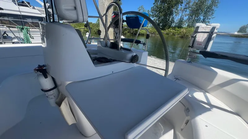 Slide: The Image of Cockpit of 2000 Hunter 410 sailboat with steering wheel and seating area. - 41