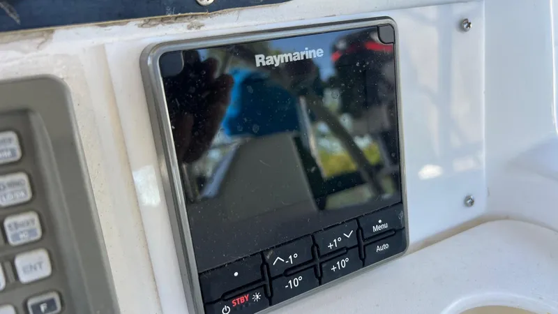 Slide: The Image of Raymarine navigation system on 2000 Hunter 410 boat dashboard. - 49