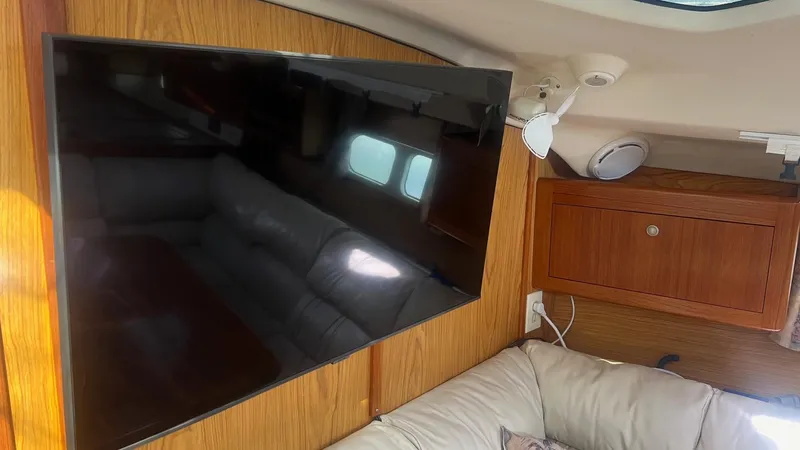 Slide: The Image of Interior of 2000 Hunter 410 yacht with TV and comfortable seating. - 9