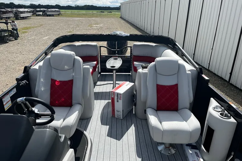 Slide: The Image of Luxurious 2025 SunCatcher ELITE 324RC pontoon boat interior with plush seating and modern design. - 10