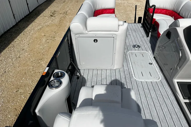Slide: The Image of Luxury interior of 2025 SunCatcher ELITE 324RC pontoon boat with plush seating and cup holders. - 12