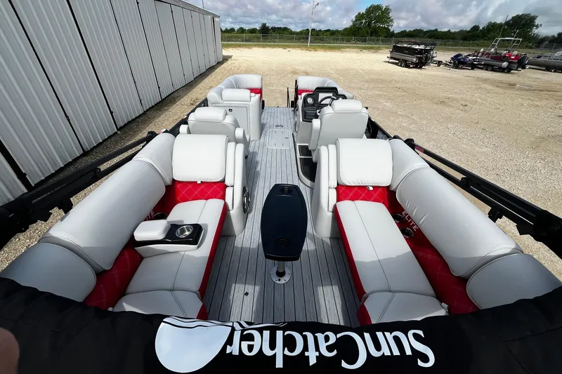 Slide: The Image of Luxurious 2025 SunCatcher ELITE 324RC pontoon boat with spacious seating and modern design. - 13