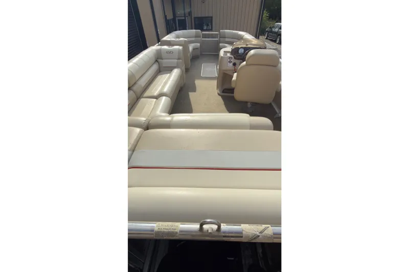 Slide: The Image of 2008 Harris Super Sunliner 220 pontoon boat with beige seating and steering console. - 5