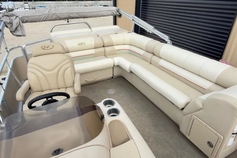 Slide: The Image of 2008 Harris Super Sunliner 220 pontoon boat with beige seating and steering console. - 6