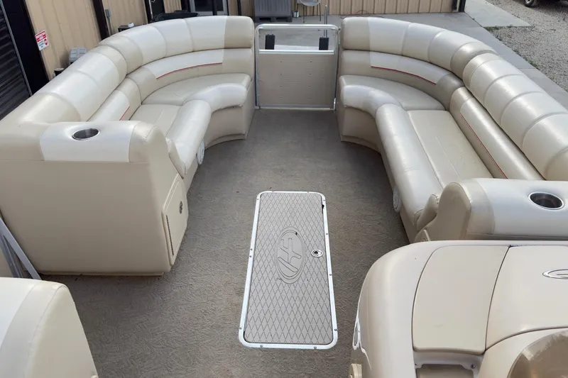 Slide: The Image of 2008 Harris Super Sunliner 220 pontoon boat interior with beige seating and cup holders. - 7