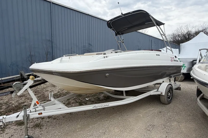 The Image of 2016 Hurricane SunDeck Sport 188 IO boat on trailer, parked outdoors. - 0