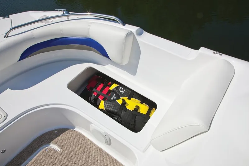 Slide: The Image of Manufacturer Provided Image: 2016 Hurricane SunDeck Sport 188 IO boat with storage compartment and life jackets. - 9