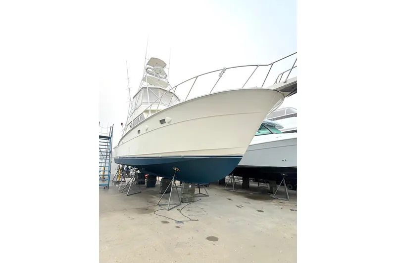 Slide: The Image of 1989 Hatteras 45 Convertible on dry dock, side view. - 4
