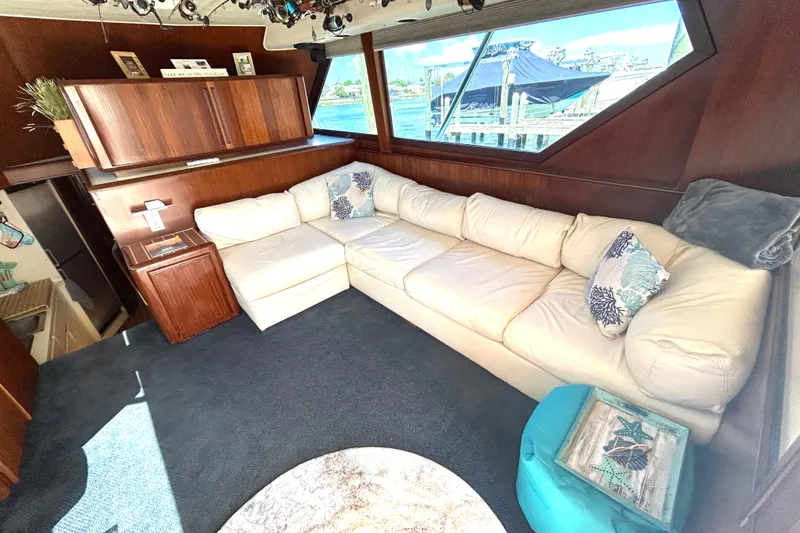 Slide: The Image of Interior of 1989 Hatteras 45 Convertible yacht with cozy white sectional sofa. - 15