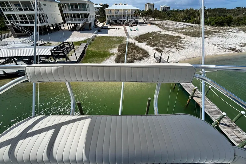 Slide: The Image of View from 1989 Hatteras 45 Convertible yacht overlooking waterfront homes and docks. - 65