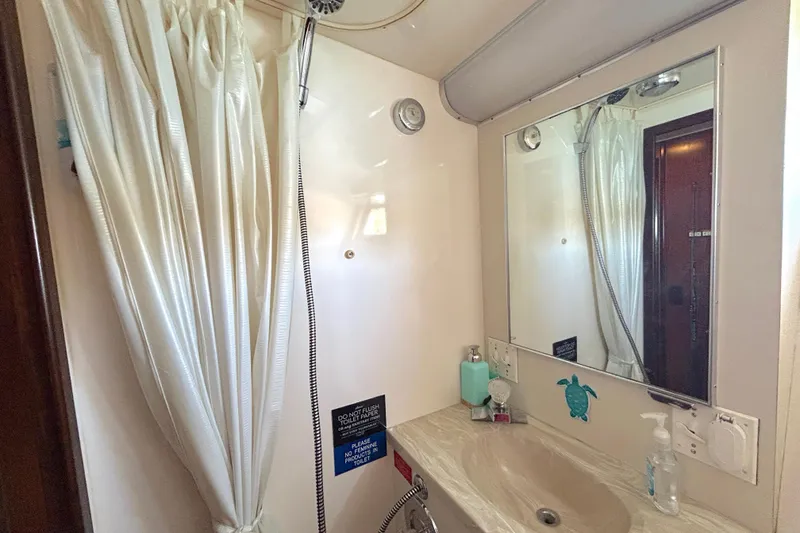 Slide: The Image of Bathroom interior of 1989 Hatteras 45 Convertible yacht with shower and sink. - 33