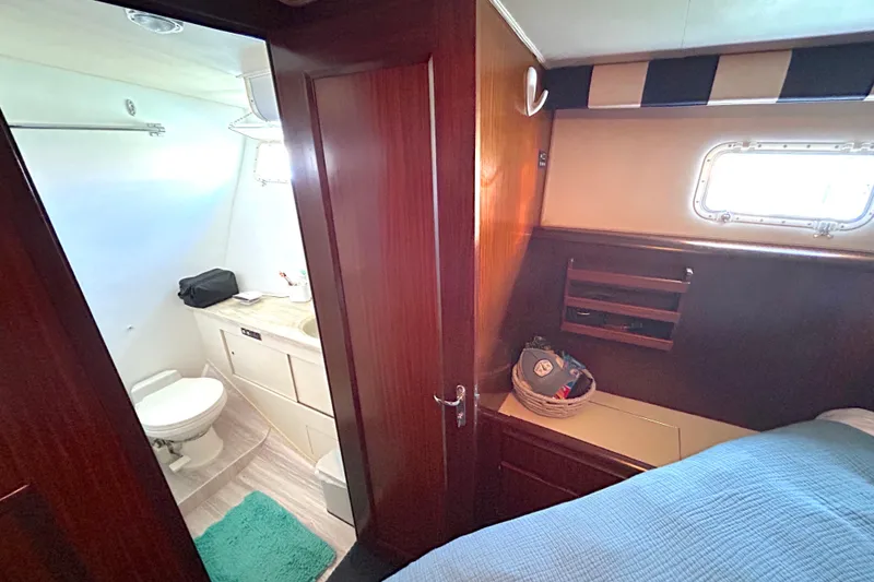 Slide: The Image of Interior of 1989 Hatteras 45 Convertible yacht with bathroom and cozy cabin. - 36