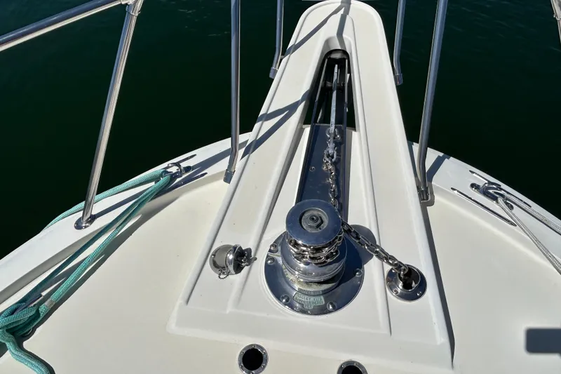 Slide: The Image of Bow of 1989 Hatteras 45 Convertible yacht with anchor chain and winch. - 15