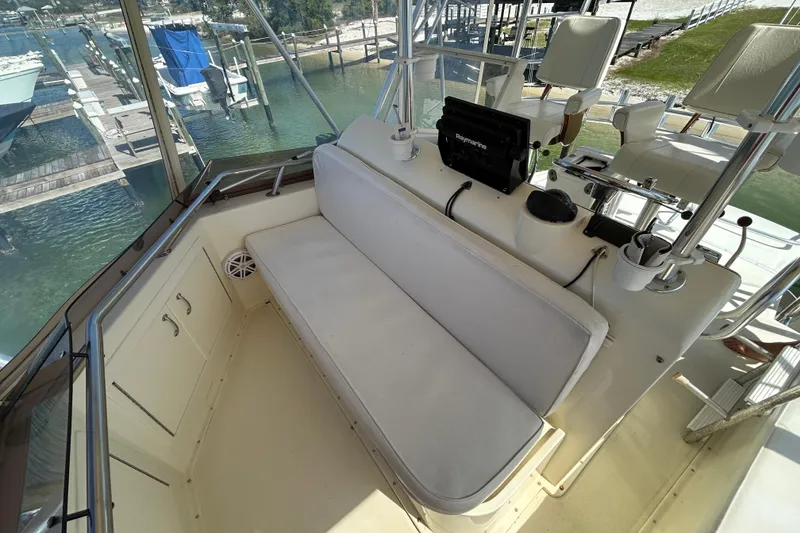 Slide: The Image of 1989 Hatteras 45 Convertible boat cockpit with seating and navigation equipment. - 46