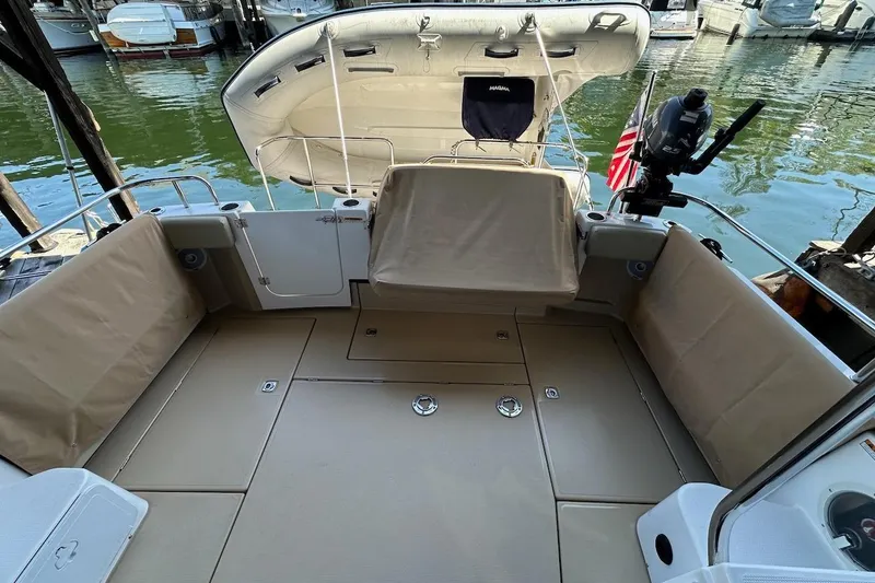 Slide: The Image of 2018 Ranger Tugs R-29 CB boat interior with seating and water view. - 13