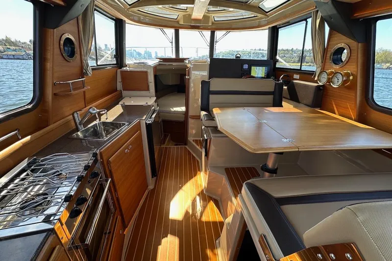 Slide: The Image of Interior of 2018 Ranger Tugs R-29 CB with wood finish and modern amenities. - 29