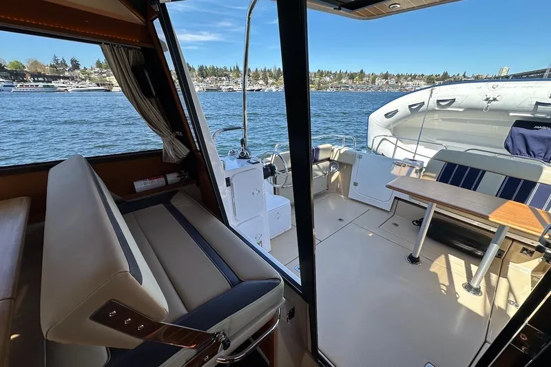 Slide: The Image of Interior view of 2018 Ranger Tugs R-29 CB boat with seating and table. - 33