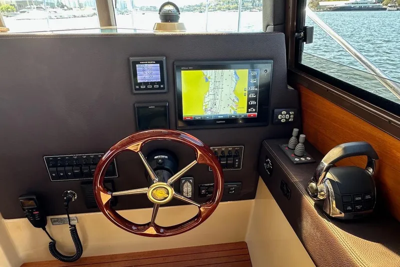 Slide: The Image of Cockpit of 2018 Ranger Tugs R-29 CB with navigation display and controls. - 36