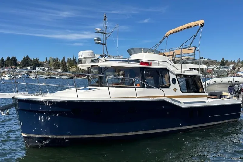 Slide: The Image of 2018 Ranger Tugs R-29 CB boat on water, sunny day, scenic background. - 4