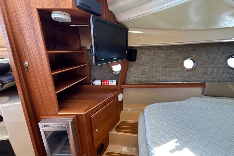 Slide: The Image of 2018 Ranger Tugs R-29 CB bathroom with modern fixtures and wood accents. - 43