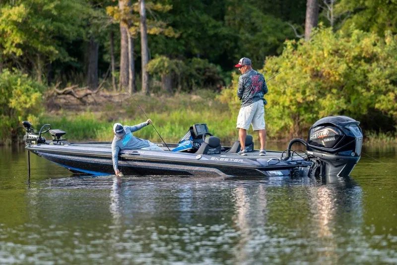 Slide: The Image of Manufacturer Provided Image: 2022 Skeeter ZX 225 fishing boat on a lake with two anglers. - 17