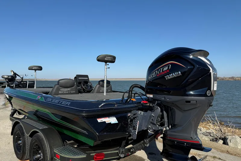 Slide: The Image of 2022 Skeeter ZX225 boat with Yamaha engine by a lake. - 3