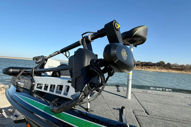 Slide: The Image of 2022 Skeeter ZX225 boat with advanced fishing equipment on a lake. - 7