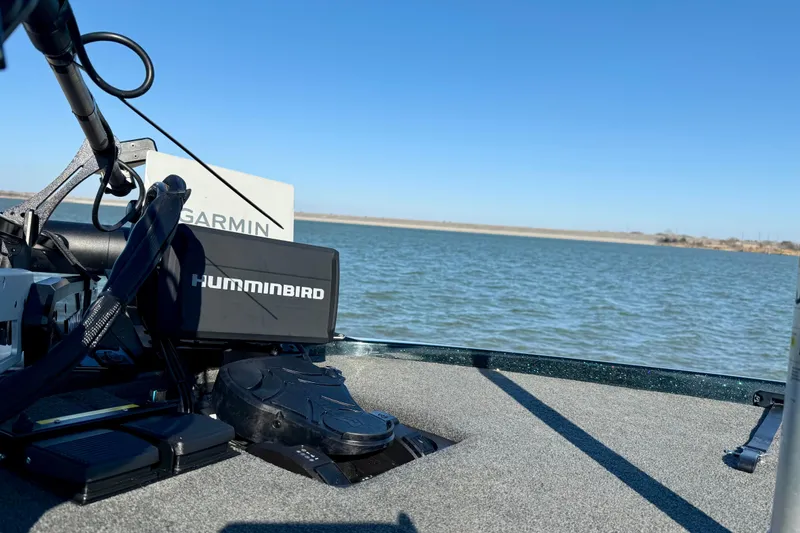 Slide: The Image of 2022 Skeeter ZX225 boat with Humminbird and Garmin equipment on a lake. - 8