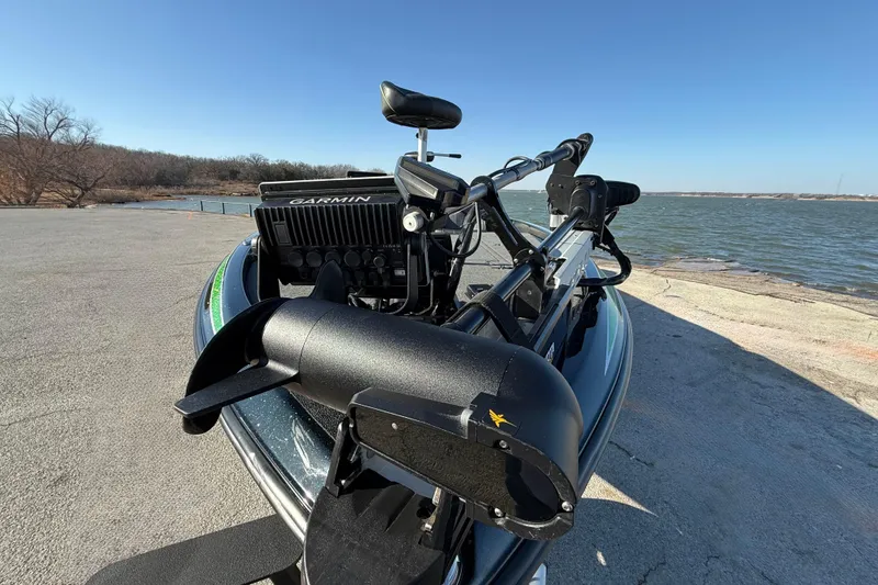 Slide: The Image of 2022 Skeeter ZX225 boat with Garmin equipment by a lakeside dock. - 9