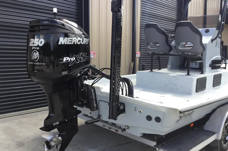 Slide: The Image of 2015 Shoalwater 23' Catamaran with Mercury 250 Pro XS engine, parked in a garage. - 10