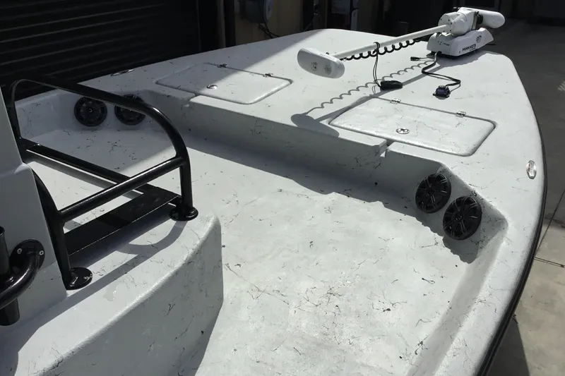 Slide: The Image of 2015 Shoalwater 23' Catamaran deck with trolling motor and storage compartments. - 6