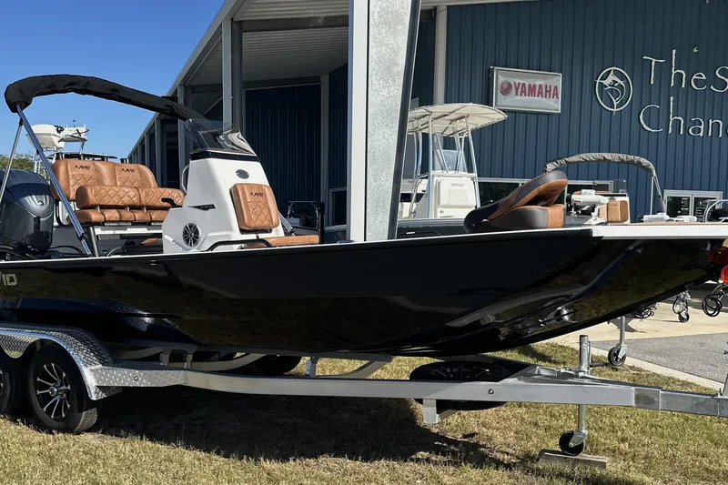 The Image of 2026 Avid 207 Recon boat on trailer, parked outside a dealership. - 0