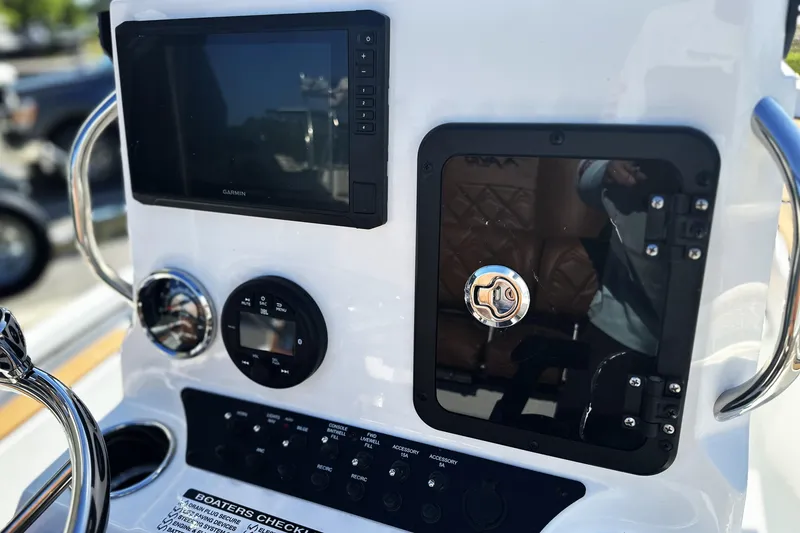 Slide: The Image of Control panel of Avid 207 Recon 2026 boat with Garmin display and controls. - 11