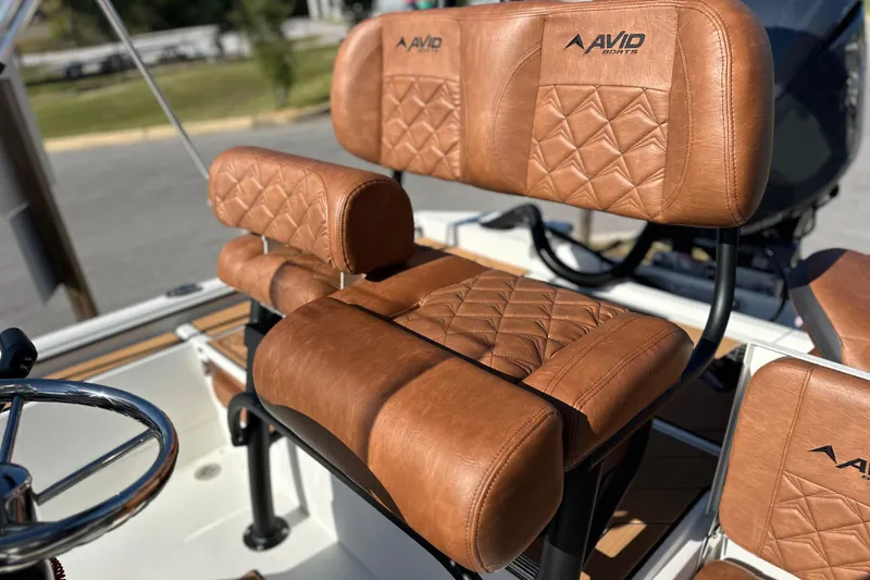 Slide: The Image of Luxurious leather seating on 2026 Avid 207 Recon boat, featuring diamond stitching and ergonomic design. - 15