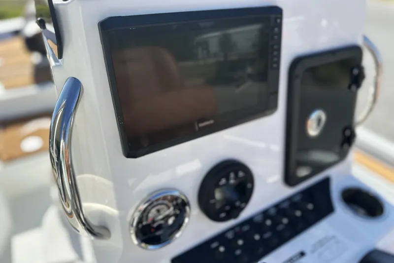 Slide: The Image of Dashboard of 2026 Avid 207 Recon boat with navigation screen and controls. - 16
