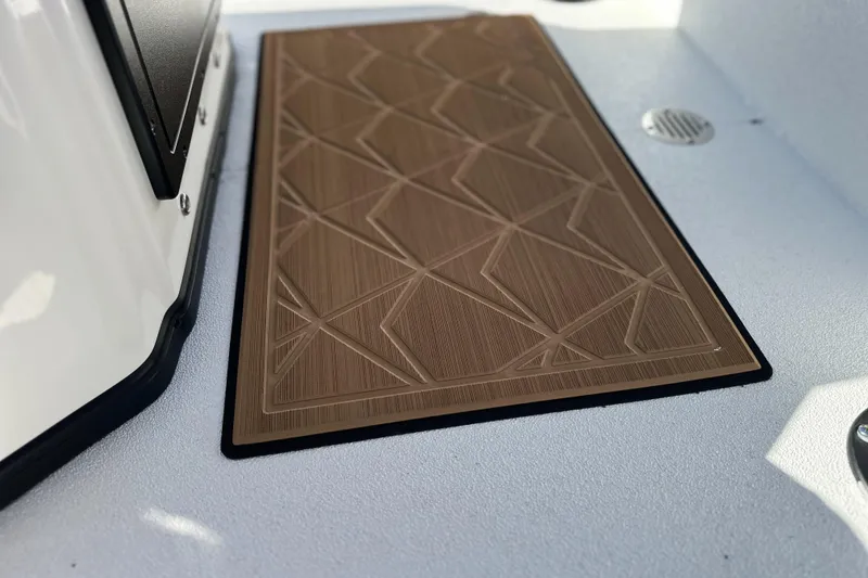 Slide: The Image of Avid 207 Recon 2026 boat deck with geometric patterned mat. - 19